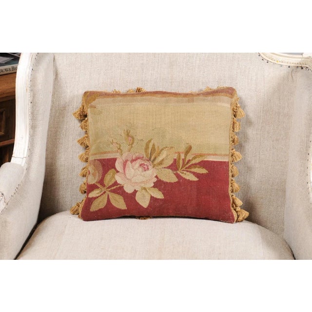 A French pillow made from 19th century Aubusson tapestry, with decor of roses and tassels. Made from an exquisite tapestry...