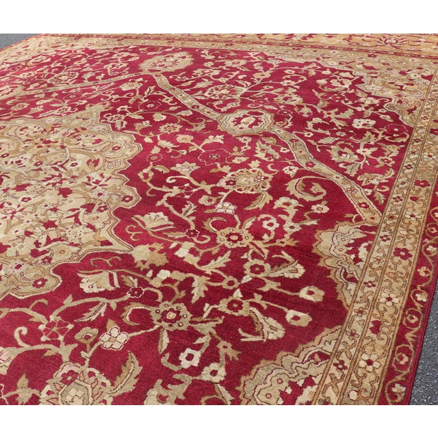Measures: 13' x 18' Large Antique Agra Carpet with Floral Design in Tones of Red, Taupe and light Green Large Antique Agra...