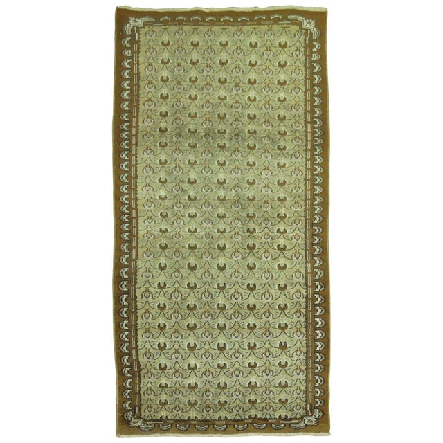 Mid-Century Turkish Runner with an all-over tulip motif in olive green and brown. 3'5'' x 6'7''
