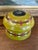 Charming vintage lidded wooden box featuring a hand-painted olive-green lacquer finish adorned with rows of red and white...