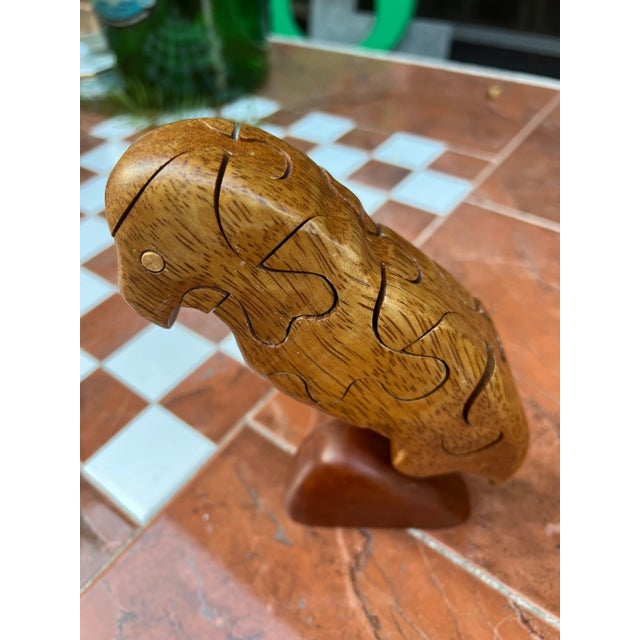 Up for consideration is a beautiful hand carved wooden puzzle piece bird statue. This would look lovely in your home and...