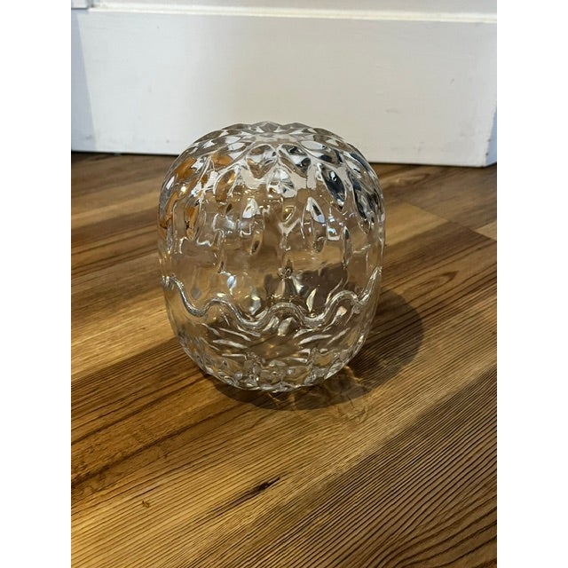 Glass piece has a top half that removes to make two bowls or can be put together to make an egg-like shape