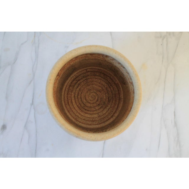 Vintage beige studio art vessel or vase. Artist stamp on bottom. Could serve as a kitchen utensil holder. No chips or cracks.