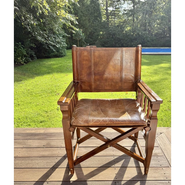 Thomasville Earnest Hemingway Collection Campaign Style Leather Chair with Brass Accents With its warm, saddle-brown...