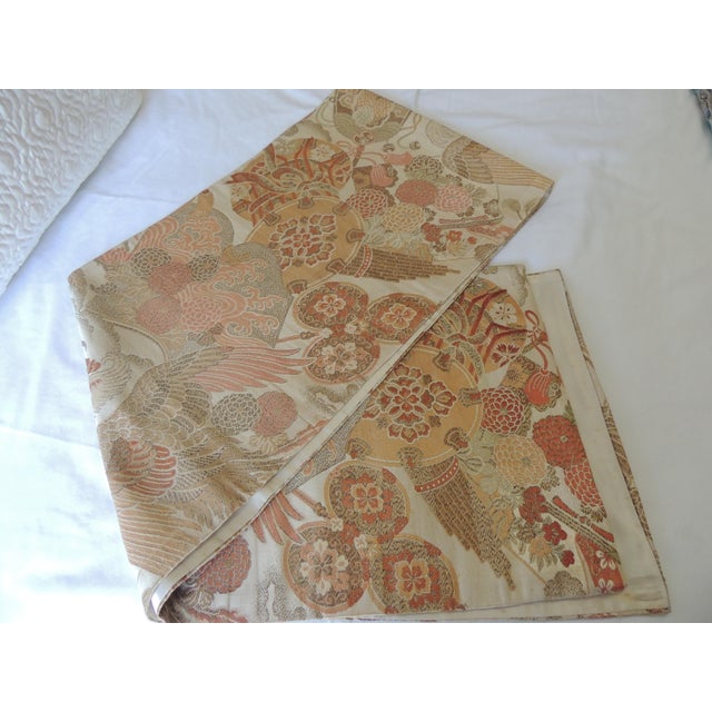 Vintage Orange and Yellow Silk Woven Obi Textile. Floral pattern with cranes, tassels and fans. Size: 12"H x 72"L