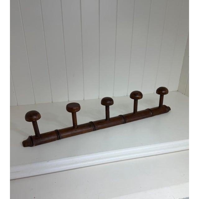 Antique Faux Bamboo Five Peg Coat Rack, Circa 1900 Add timeless character to an entryway, mudroom, or bedroom with this...