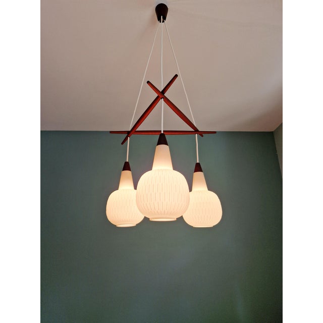 Scandinavian Chandelier in Teak and White Opaline Glass, 1960s, in Flawless conditions. Designed 1960 to 1969 Up to 250V...