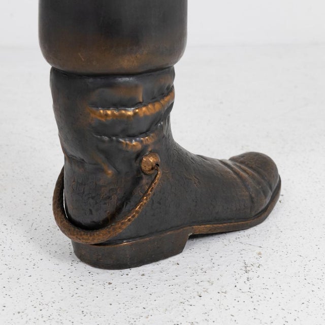 Copper umbrella stand shaped like a boot with great attention to detail