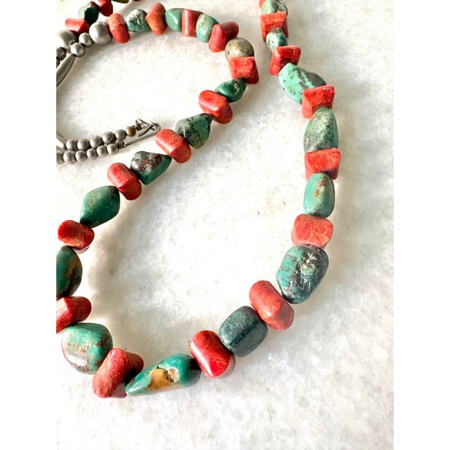 Stunning Long turquoise and coral vintage Native American beaded necklace with sterling silver clasp. 28” long