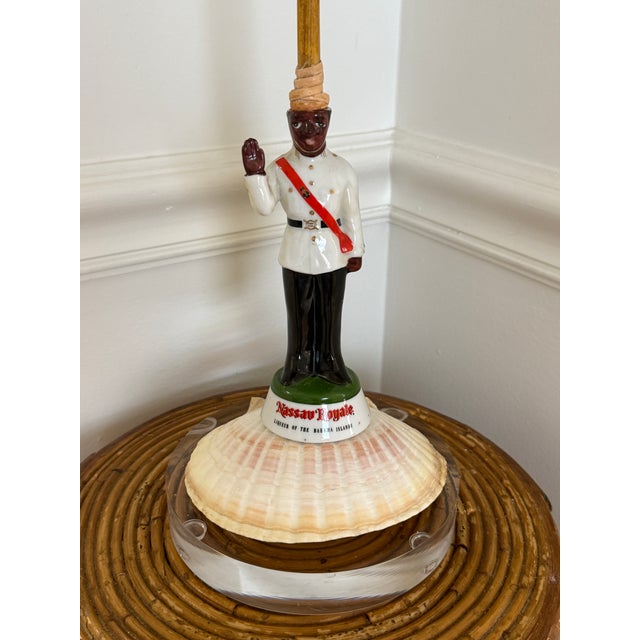 Vintage NASSAU ROYALE BAHAMAS POLICE DECANTER made into a table lamp. Lucite base and large scallop shell. Rechargeable...