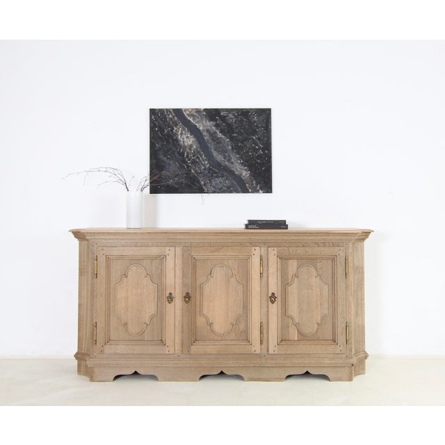 Vintage sideboard in oak. Early to mid-20th century. Ready for everyday use with a sanded finish. A solid oak body...