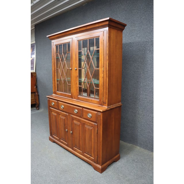 A substantial Nichols & Stone cherry breakfront offered with the base/server as the primary piece. The base features four...