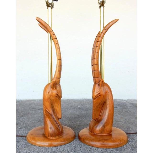 Magnificent moderne gazelle bust table lamps. Skillfully sculpted in walnut. Not signed or marked. Both are in excellent...