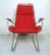Vintage industrial rocking chair made of welded iron! Sink into the plush red cushion and relax as you rock the day away....