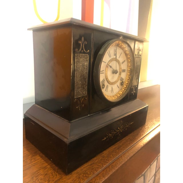 Opulent vintage wood and metal black and gold mantle clock. No keys. Use as decorative object or bring to a clock shop to...