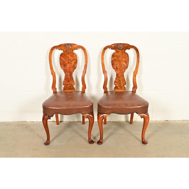 An outstanding pair of antique English Georgian or Queen Anne side chairs or dining chairs In the manner of Baker...