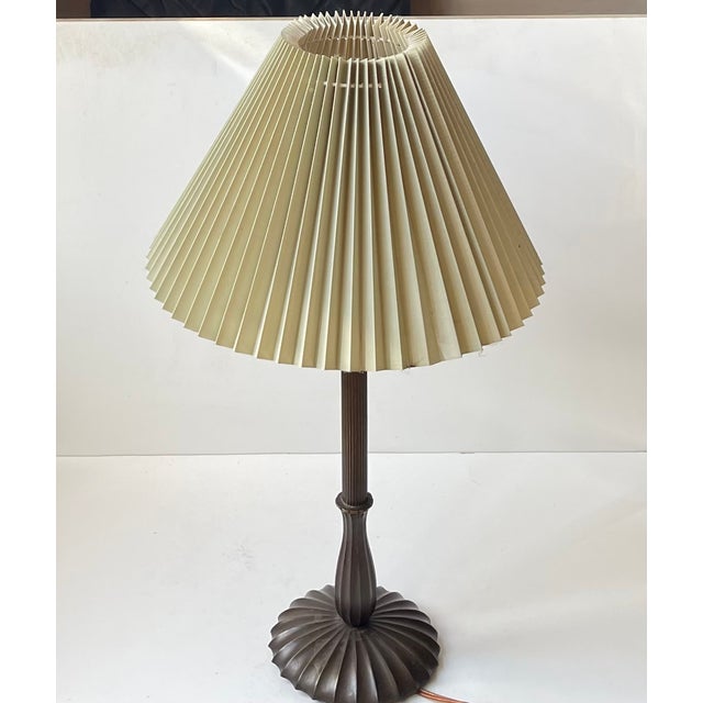 A stylish architecturally fluted table light in patinated bronze. Possibly designed by just andersen for gab ab in sweden...