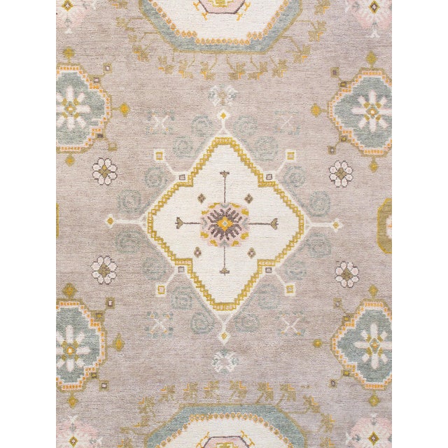 Khotan hand-knotted rugs are quite unique folk artifacts which display elements of rich, historical cultures. These rugs...