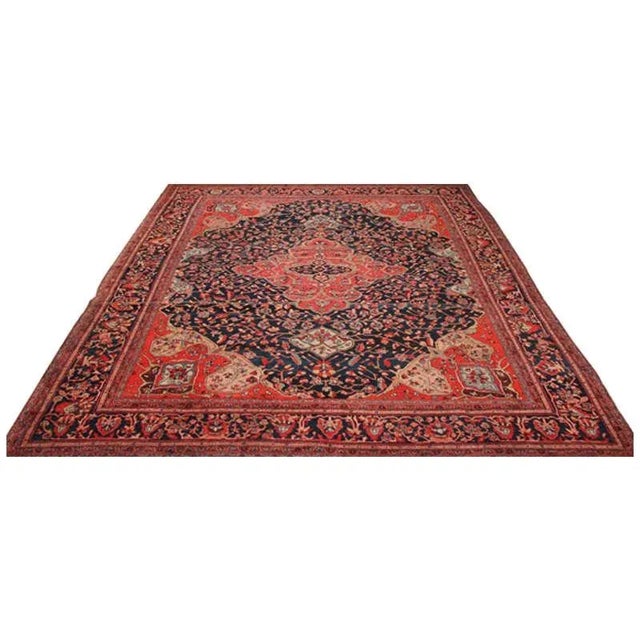 ACTUAL SIZE: 8’10” x 12’0″ PRIMARY COLOR: Terracotta / Navy AGE: Antique MATERIALS: Wool FOUNDATION: Cotton PRODUCTION:...