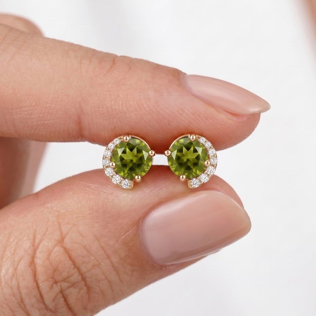 Add a touch of radiant, natural beauty to your jewelry collection with these stunning Peridot Stud Earrings., These...