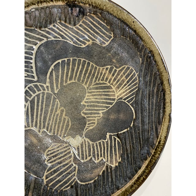 This is a stunning extra large Gerald Newcomb studio pottery charger. This is a heavy, substantial piece that will make an...