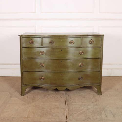 Good early 19th century English serpentine front oak commode. 1810. This piece is designed in the style of the selected...