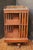Early 20th century English revolving bookcase. Mahogany with neo-classical style repetitive vasi-form brass gallery top....