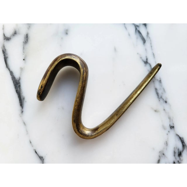 Beautiful original mid century modern 1950s Carl Auböck modernist brass hook, handcrafted in Austria. Heavy and smooth to...
