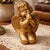 Vintage Caffco gold cherub figurine depicts a kneeling angel in a prayerful pose. This charming piece features a matte...