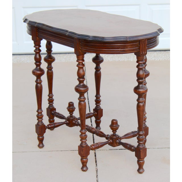 Bring timeless elegance to your home with this handsome early 20th-century Victorian-style library table. Crafted with a...
