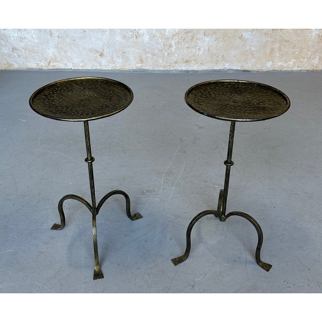 Recently crafted by skilled European artisans, this charming pair of gilt iron Spanish end tables showcases traditional...