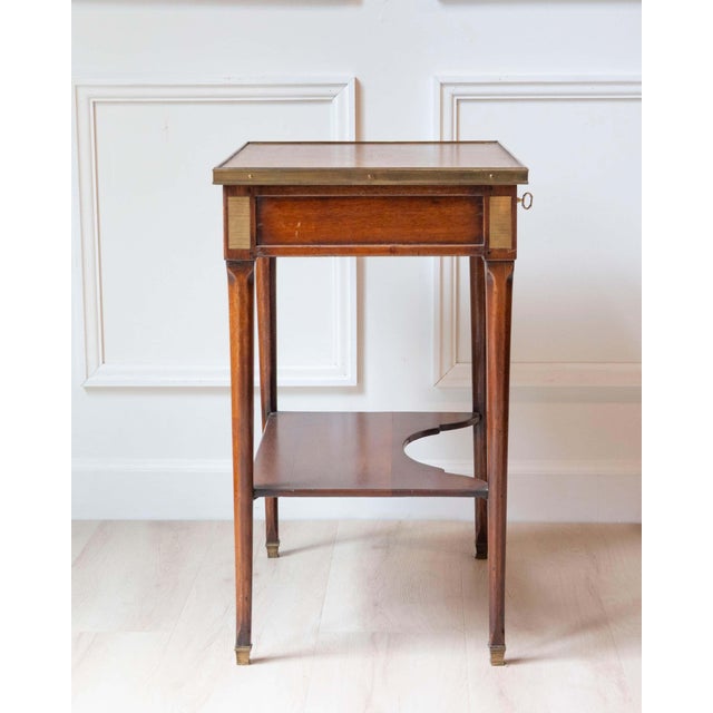Elegant Louis XVI style writing table crafted in walnut, dating from the mid-20th century and inspired by late 18th-...