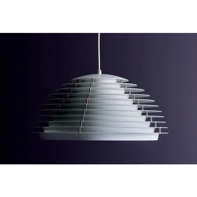 Sculptural Danish pendant lamp by Fog & Mørup, model "Hekla". Designed with layered aluminum slats to diffuse light evenly...