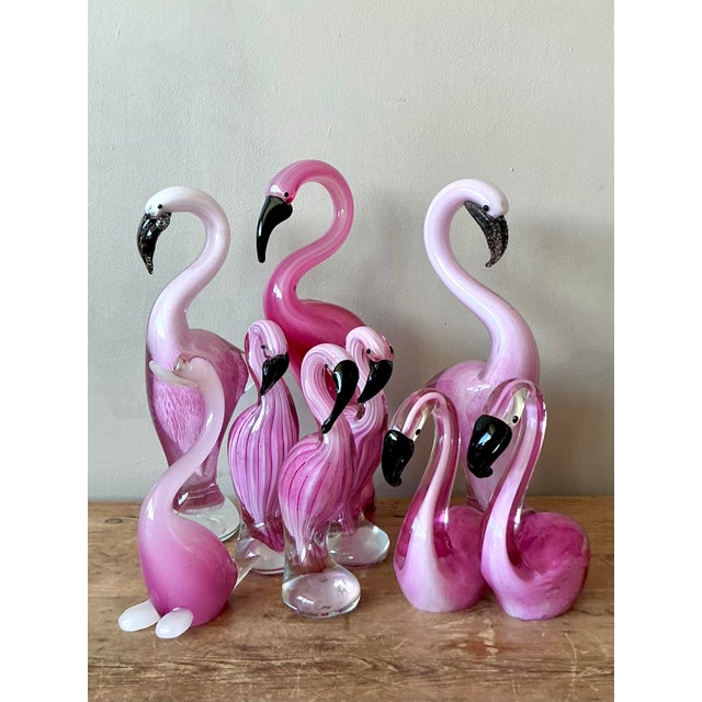 Presenting an exquisite collection of nine vintage Italian Murano art glass birds, featuring a charming array of flamingos...