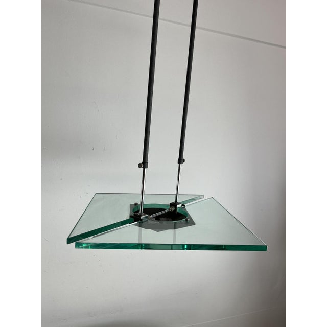 Italian Nile green Murano glass chandelier in the style of Fontana Arte, 1980s. Metal structure. Halogen lamp. Good...