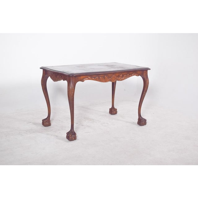D. João V style coffee table. with a rectangular top and rounded corners, it rests on four richly carved cabriole legs,...