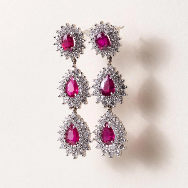 We offer free 2-day shipping! These are a stunning pair of ruby and diamond dangle earrings set in platinum Circa 1970...