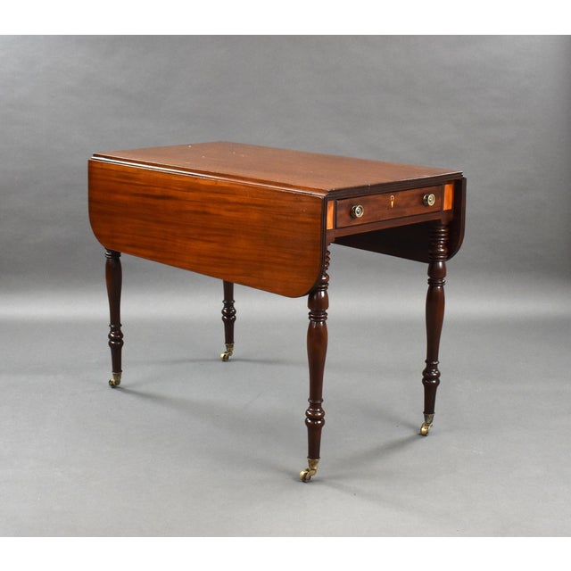 For sale is a good quality Regency mahogany pembroke table, having two drop leaves above a single drawer to the front and...