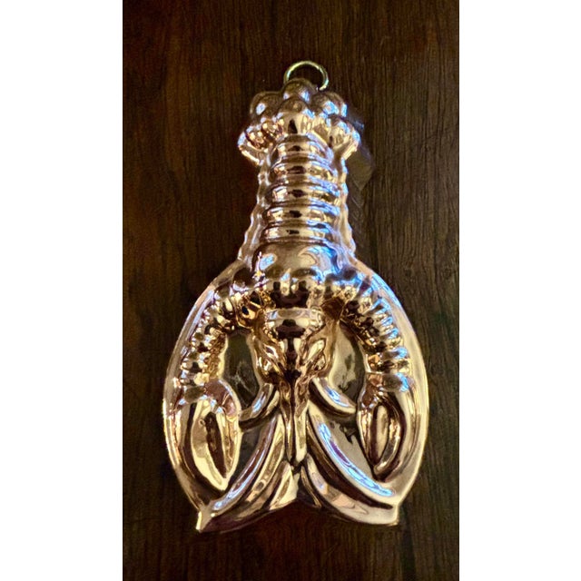 A pair of not quite matching lobster food molds. In near perfect condition, newly polished.