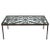 This cocktail table is somewhat rustic yet refined at the same time. The base is wrought iron, featuring a lovely scrolled...