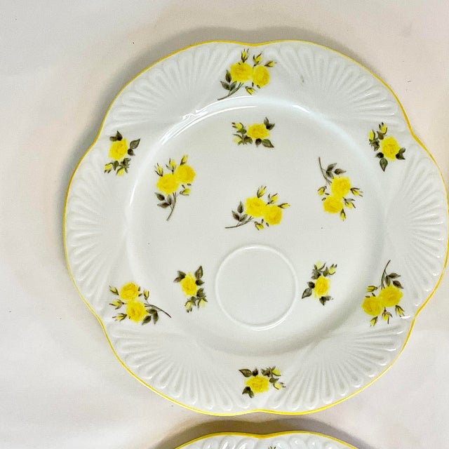 These are a set of 4 delightful Dessert Plates from the 1950s. They feature scattered dainty yellow roses and a scalloped...