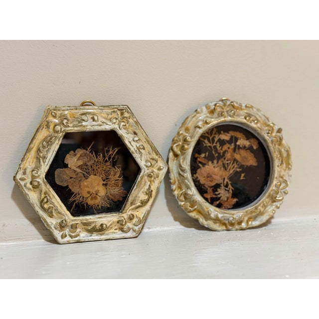 Charming pair of vintage botanical shadowbox artworks featuring delicate arrangements of naturally dried and pressed...