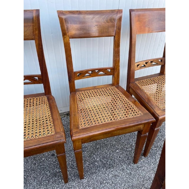 Group of eight chairs in fruit wood and trapezoid-shaped seat in Vienna straw. Healthy and solid structure, the Vienna...