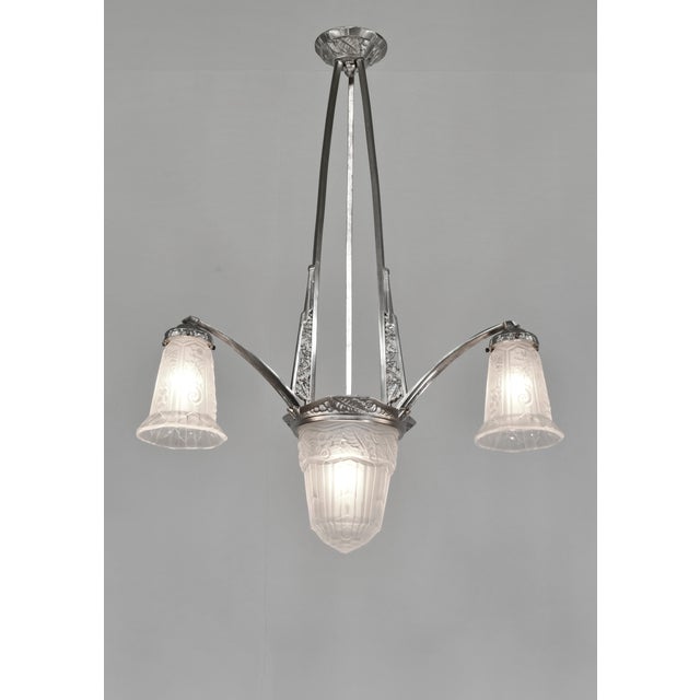 MAYNADIER A French 1930s art deco chandelier in nickel plated solid brass or bronze by Maynadier. Pierre Maynadier had a...