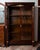 Two-door Empire bookcase in mahogany crotch with gilded bronze inserts, dating back to the early 19th century. The front...