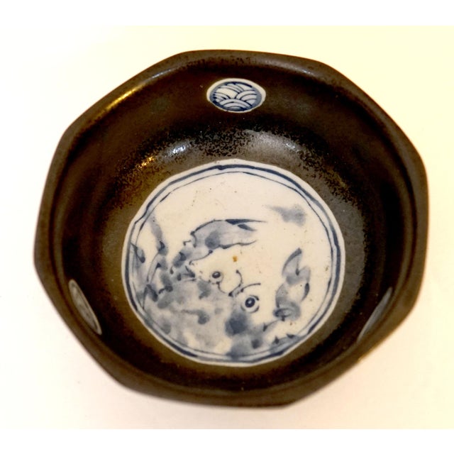 I love this fantastic piece. This Korean Brownish-black glazed bowl has a blue and white ceramic center. The contrast...