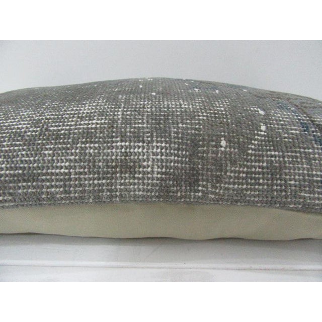 This is a pillow cover made from a vintage kilim rug. The piece was properly washed and ready to use. Pillow inserts not...