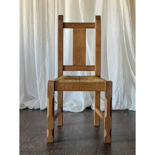 This set of six rustic French oak dining chairs features a beautifully aged, oak finish with substantial ladder-style...