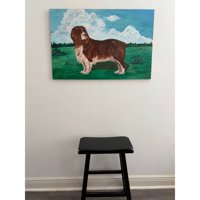 Large vintage folk art dog portrait painted on panel, signed and dated “K. Hines ‘70” lower right. Features a brown and...