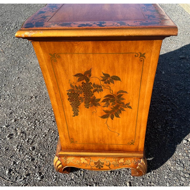 Vintage hand-painted Chinoiserie style serpentine chest featuring three spacious drawers. Detailed with botanical floral...